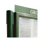 A-Multi aluminium noticeboard showing detail of Contemporary post finial and straight-pattern header
