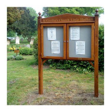 2-bay, 4 x A4 oak noticeboard with end posts, gable header and acorn post caps, St Cecilia's Church, Little Hadham