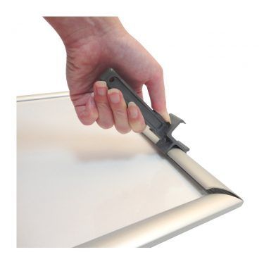tamper-proof snap frame showing opening tool
