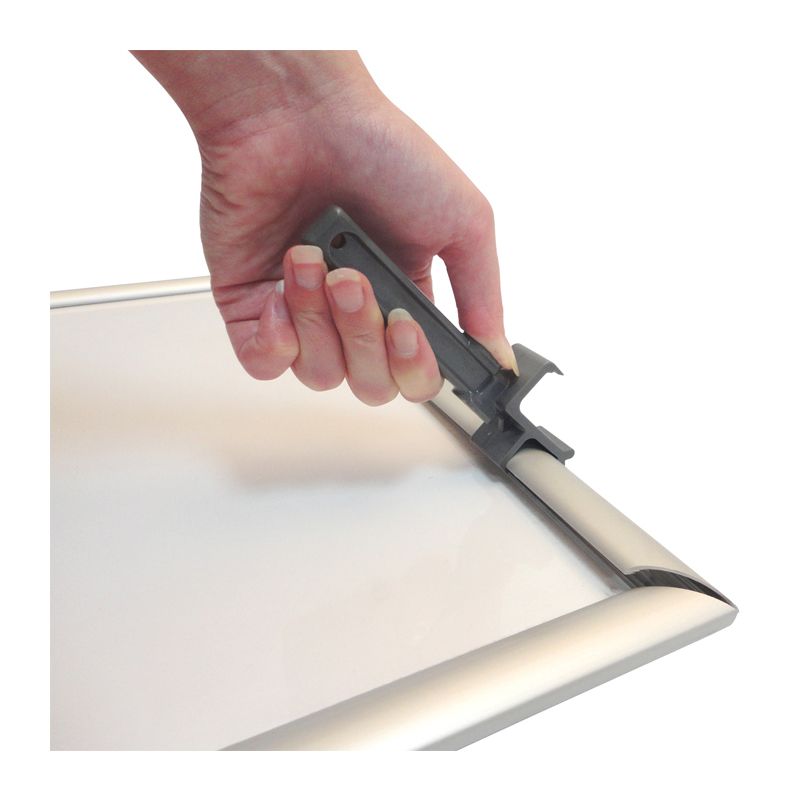 tamper-proof snap frame showing opening tool