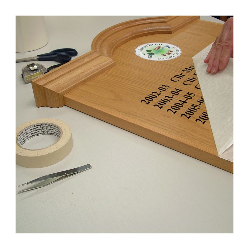 applying vinyl text to an honours board